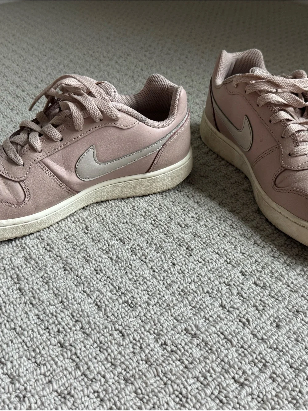 Nike Women’s Blush Pink Low-Top Sneakers with White Swoosh